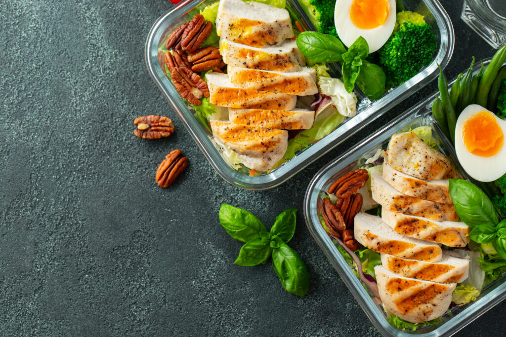 Healthy meal prep containers with chicken breast.